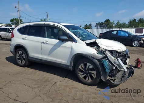 2016 Honda Cr-V Touring z USA, uszkodzony, nr VIN 5J6RM4H94GL025220